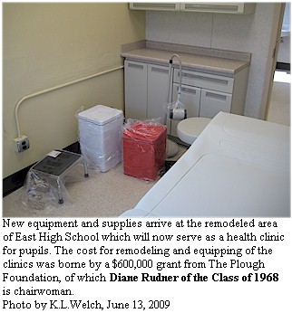looking into one of the new examination rooms